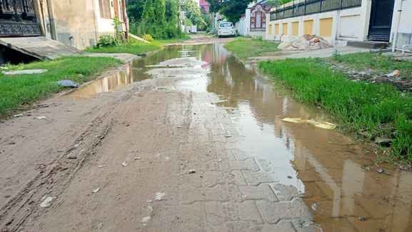 The name is Awas Vikas Colony, its identity is broken roads, choked drains
