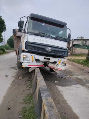 Truck climbed over incomplete divider, got damaged
