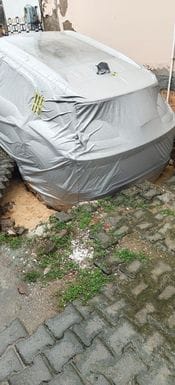 Road collapsed due to rain, car got stuck inside the pit