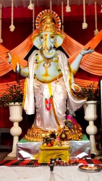 Gajanan is sitting in the pandals, somewhere he is decorated with fruits and somewhere he is writing an epic.