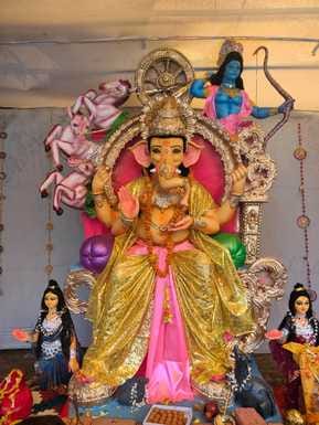 Lord Ganesha, the destroyer of obstacles, is seated in the puja pandals