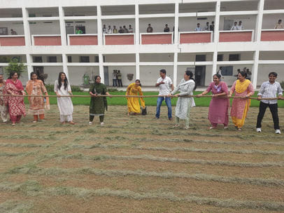 The school staff showed their strength in tug of war and volleyball matches