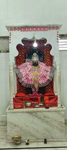 Dauji Maharaj was seated in the flower bungalow and offered butter and sugar candy