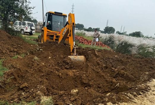 Bulldozer runs on illegal colony being built on 12.5 acres