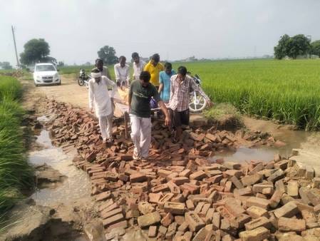 Ambulances are helpless on broken roads, the sick have to be carried on cots