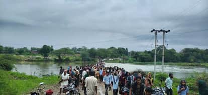 Family along with bike swept away on river bridge