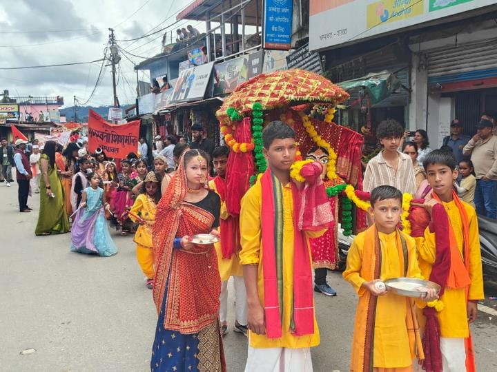 School children took out a tableau in Nanda-Sunanda Festival