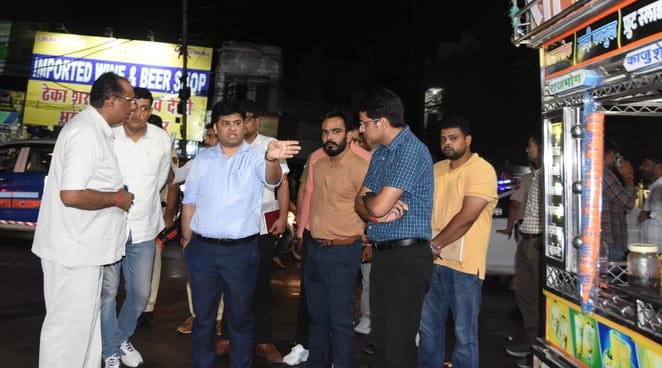 Officers on patrol at night, cleanliness checked at ground level