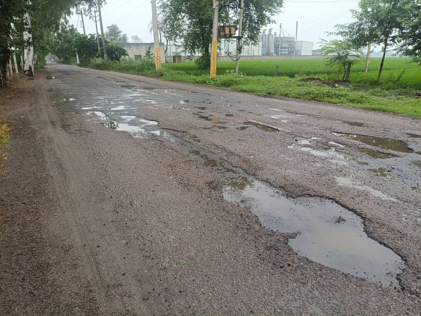 The three kilometer long road is broken at many places