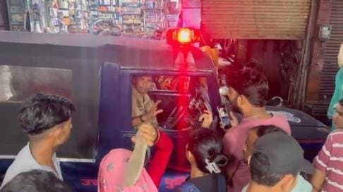 The policeman driving the car ran over a woman's foot