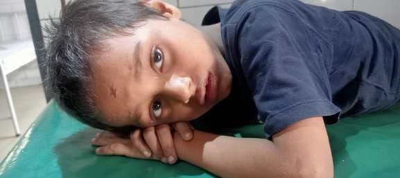 A dog attacked a child playing with other children, and also bit the young man who went to rescue him