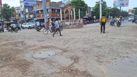 Road left after putting gravel for four months, shopkeepers upset