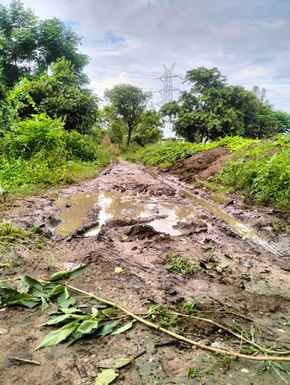 Due to rain, the roads are muddy and waterlogged, causing problems for the villagers