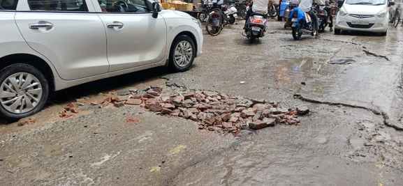 Roads were damaged at many places due to rain, police installed barricades for security