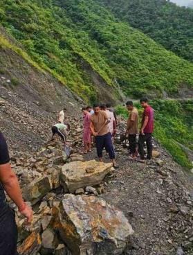 The youth held shovels, axes... and the boulders lost their courage