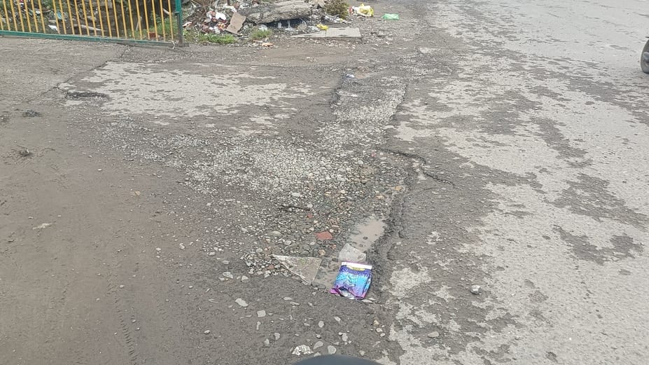 Highway damaged due to rain, potholes in many places, danger at every step