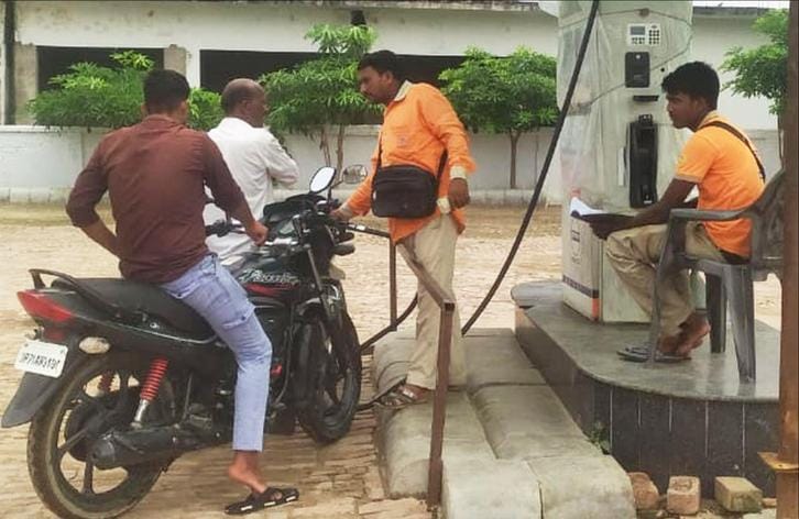 No helmet, no fuel rule is in the air, no effect is visible on petrol pumps