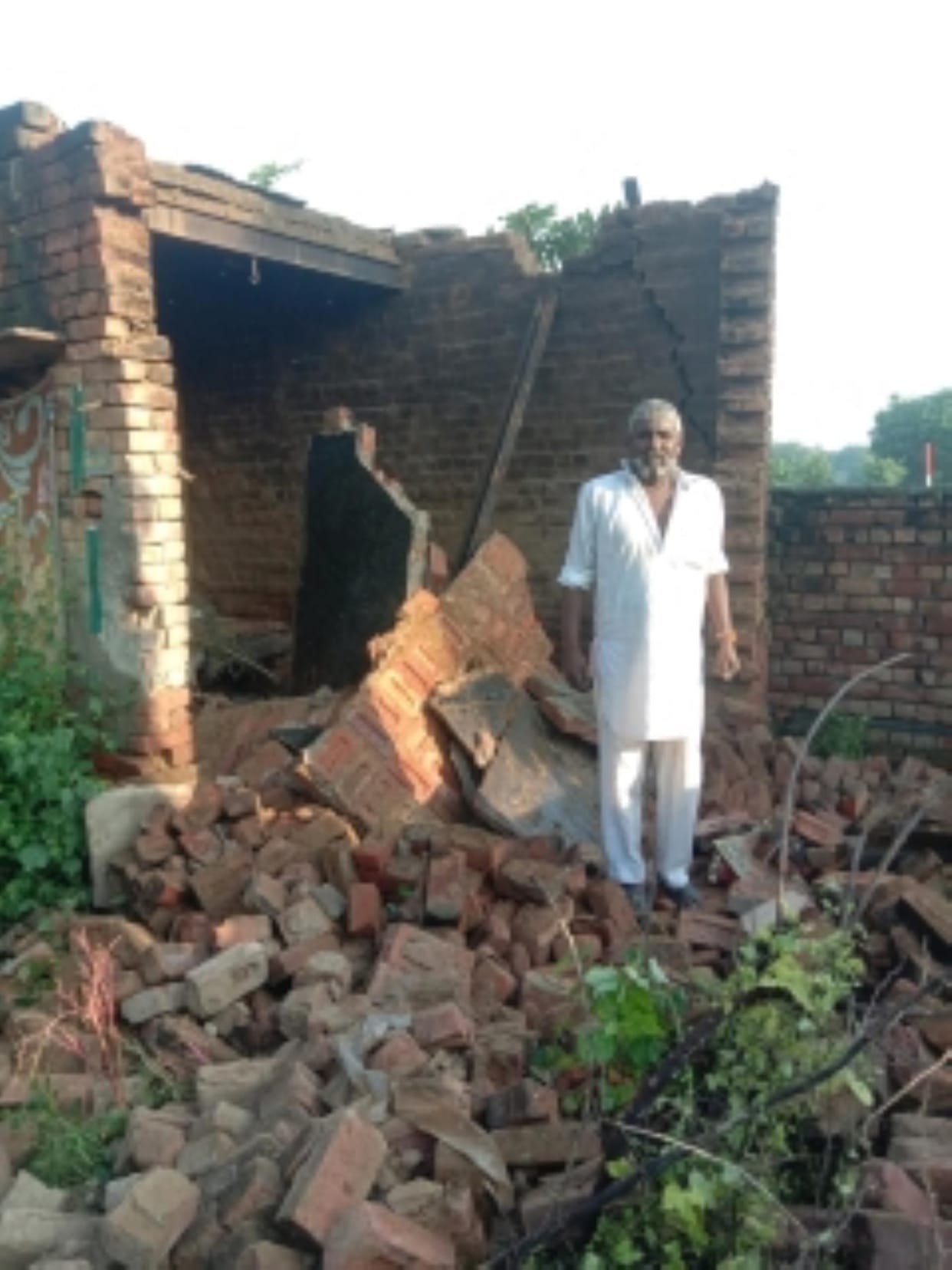 The roof of a room collapsed in Devrala, Phoola Ram was living under a tarpaulin