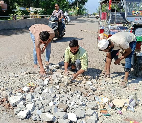 When no hearing took place, the local residents started filling the pits themselves
