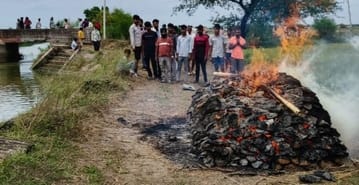 The cremation ground and the road were filled with water, the last rites were performed outside the village
