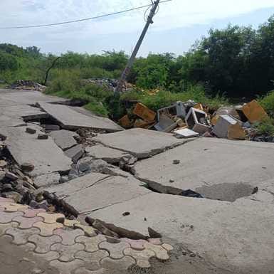 Cement road collapsed due to soil erosion