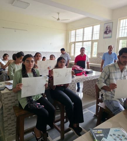 Anu tops the bird collage competition in Government College