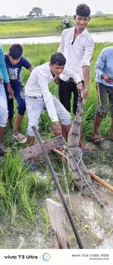 Crocodile trapped in net, young man scared