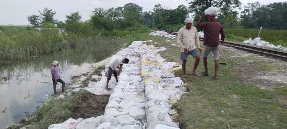 Stopped water leakage from under the railway line by placing sacks