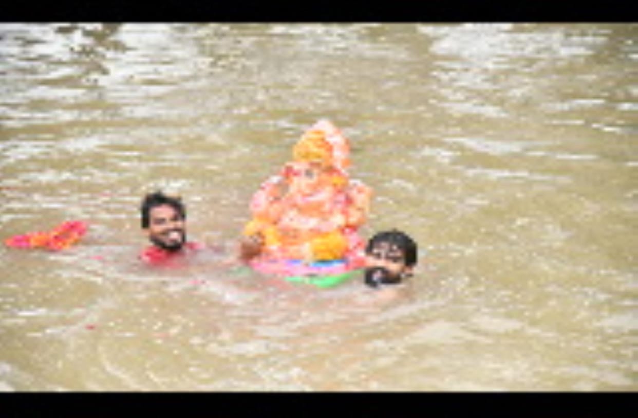 Farewell to Ganpati Bappa with gulal, dhol and devotion