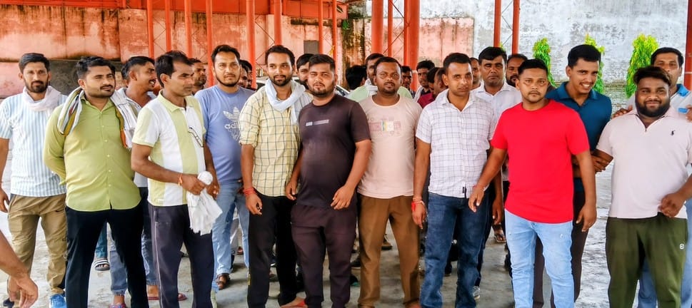 Employees doing meter reading work on contract staged a sit-in