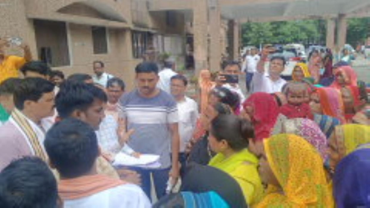 Women who had come to meet the DM surrounded the MLAs