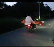 When there was a delay in the last rites, the dead body was taken away on a bike