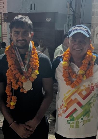 Villagers welcomed Olympian Sanjay Kaliraman on his arrival in the village