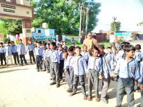 Piles of garbage outside two government schools in Dharsool village