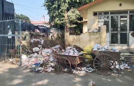 A pile of garbage is forming at the main gate of the district hospital