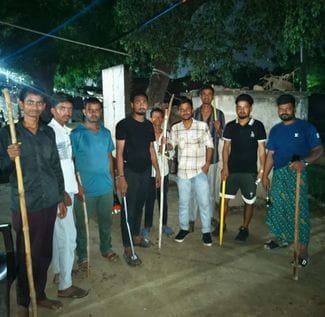 Villagers guarding with sticks