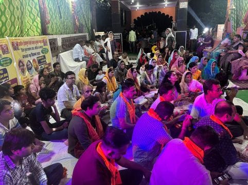 The temple courtyard resonated with bhajans, devotees took prasa