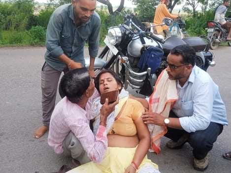 Teacher lying injured on the roadWoman taken to hospital
