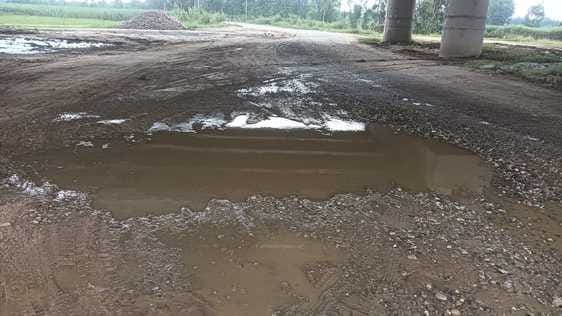 The dilapidated road from Gadipukhta to Oon, water filled in the potholes during rain