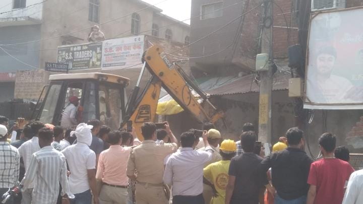 JCB roared on encroachment, demolished concrete wall and tin shed