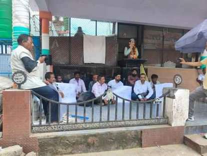 The villagers of Bhald village staged a sit-in protest by tying black bands
