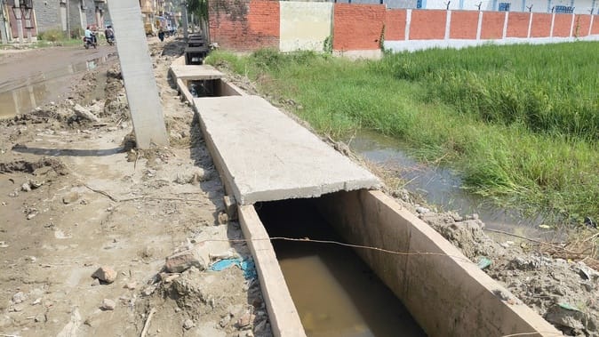 The drain made of crores started breaking before it was built