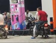 SP City arrived on bike, got petrol without helmet