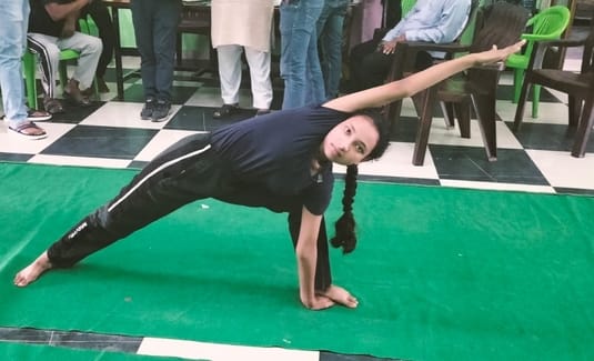 Karuna of Kanya Gurukul Narangpur first in yoga competition