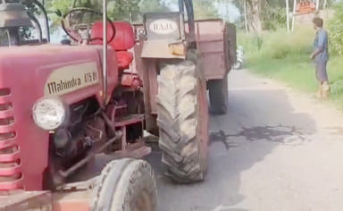 Woman dies after being hit by tractor