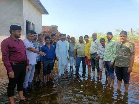 Volunteers met families affected by waterlogging