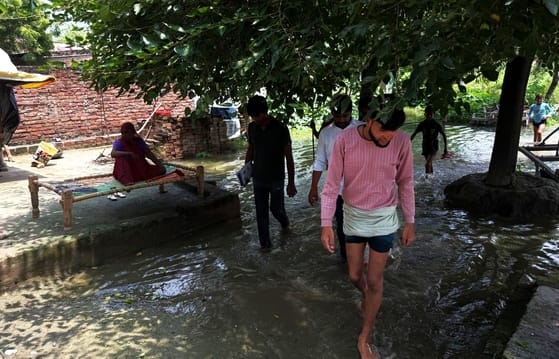 After the flood subsides, the villagers are now struggling with mud and dirt