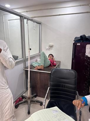 Emergency department shift, glucose being administered to patients on table