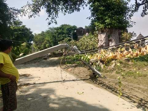 Broken electric poles lying on the road in Tatian