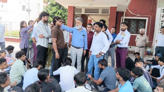 The student was beaten up and taken to the department head's office, and his friends protested